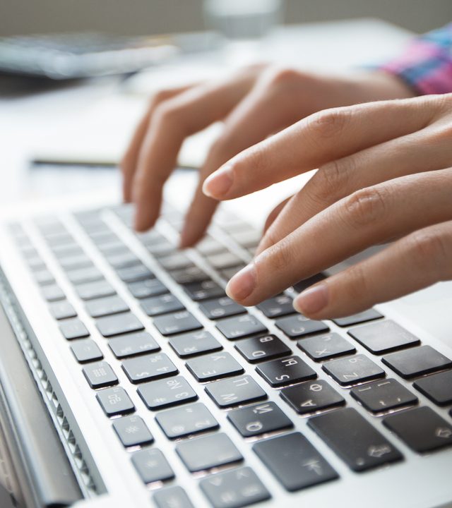cropped-view-of-hands-typing-on-laptop2